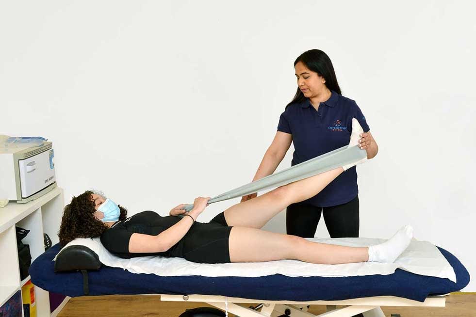 Osteopathy  treatment on leg by trusted osteotherapist near me